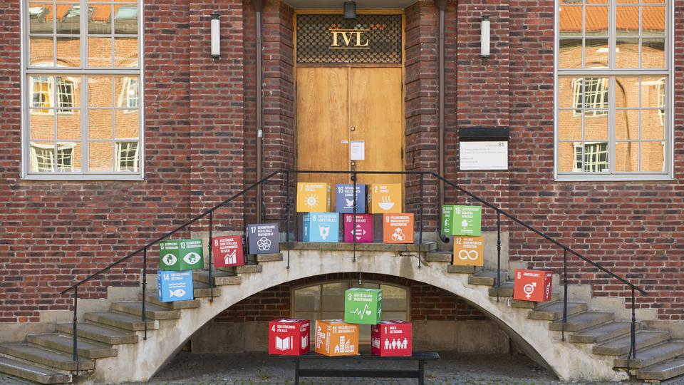 The IVL office entrance and staircase full of card board cubes with the sustainable goals printed on them.